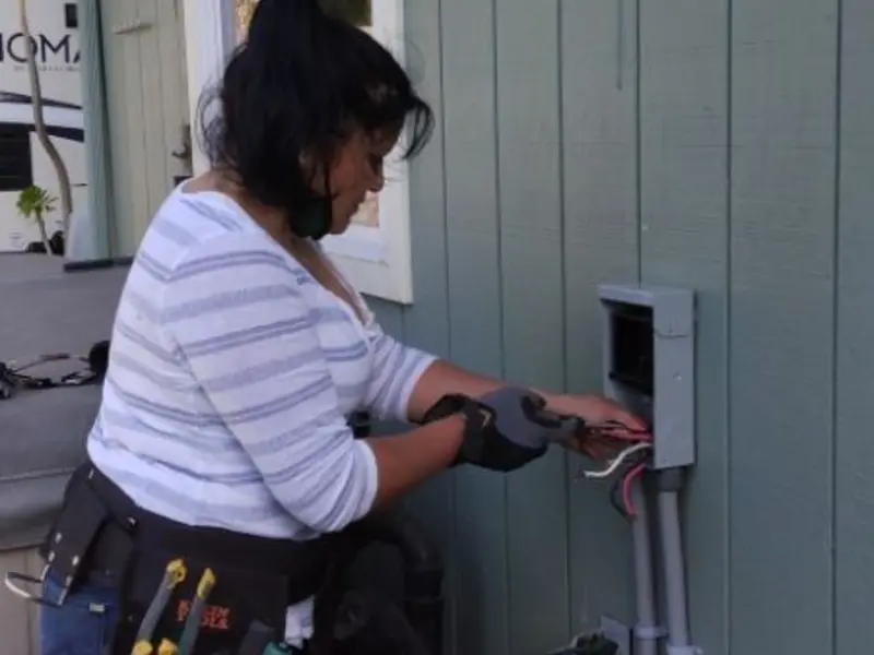 Licensed electrician wiring an exterior subpanel in Brenham