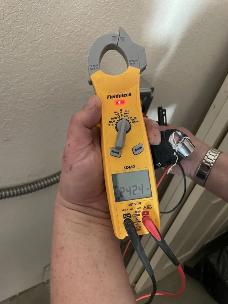 Voltage testing with clamp meter during Outlet Installation in Brenham